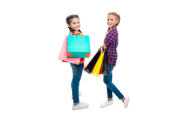Fototapeta premium teen children go shopping. girls with shopping bags. shopping sale and discount. teen children girls with bags. Girls enjoying a day of shopping