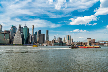 manhattan view of building in metropolis city with skyscraper skyline with barge