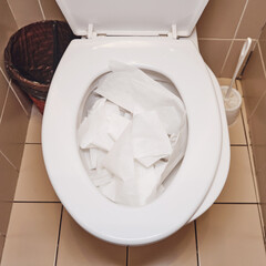 The office toilet experienced a blockage due to excessive use of toilet paper, requiring immediate...