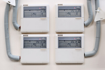 Wall-mounted control panel for a group of industrial air conditioners