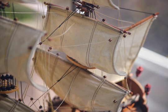 Antique gun ship with boats and sails, mock-up. Old objects of the 18th century era, reenactment of events