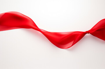 Red ribbon on a white background. International AIDS Day