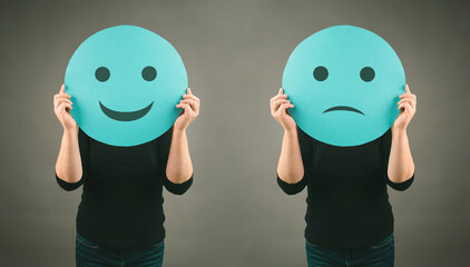Head with a sad and a happy face, mental health concept, positive and negative mindset, depression,...