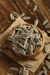 DRİED NUTS AND FRUİTS IN WOODEN BOWL ON BROWN FLOOR