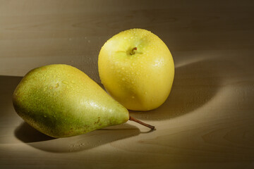 Apple and pear with water drops