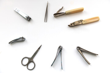 Nail clippers and scissor isolated in white.
