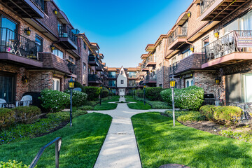 property in neighborhood. view of luxury upscale residential neighborhood community street. property insurance and real estate. suburban neighborhood. property and architecture. backyard street