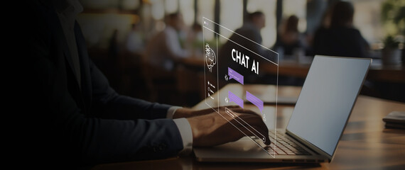 ChatGPT, Chat with AI. Man using a laptop chatting with an artificial intelligence.