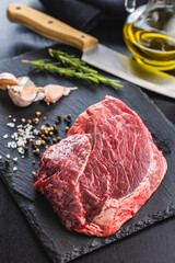 Raw fillet steak beef meat on cutting board.