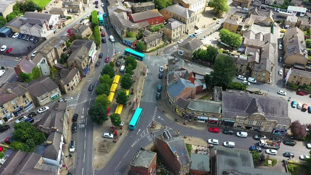 Aerial footage of the beautiful historical town of Batley in the Metropolitan Borough of Kirklees, West Yorkshire, England showing the historical town centre and market stalls in the summer