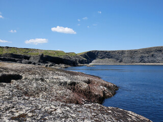 Cliffs and Atlantic ocean, clouds, rocks and laguna, beauty in nature. Vacation trip relaxation background