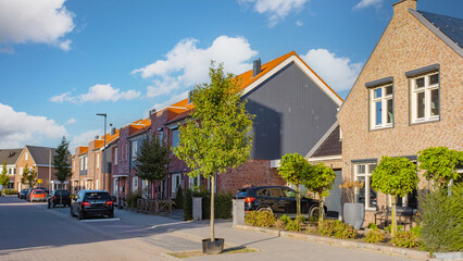 Dutch Suburban area with modern family houses, newly build modern family homes in the Netherlands, dutch family house in the Netherlands, Modern green neighbourhood - obrazy, fototapety, plakaty