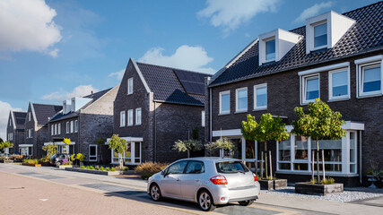 Dutch Suburban area with modern family houses, newly build modern family homes in the Netherlands, dutch family house in the Netherlands, newly build street with modern house