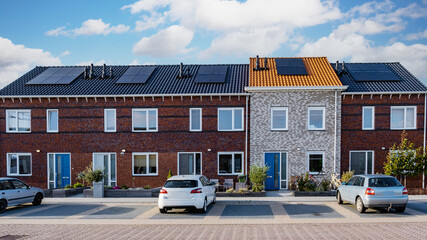 Dutch Suburban area with modern family houses, newly built modern family homes in the Netherlands, dutch family houses in the Netherlands, A row of typical Dutch suburban houses - obrazy, fototapety, plakaty
