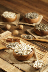 DRİED NUTS AND FRUİTS IN WOODEN BOWL ON BROWN FLOOR