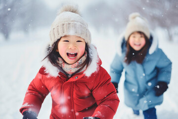 asian kids having fun and playing in the snow - 636207669