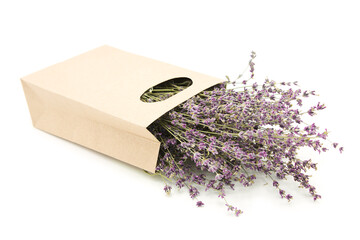 Bouquet of lavender flowers in a cardboard organic bag isolated on a white background.