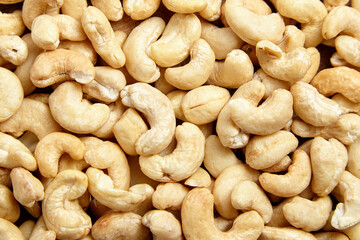 Cashew nut heap food texture background. Cashew heap, a source of healthy fats, top view