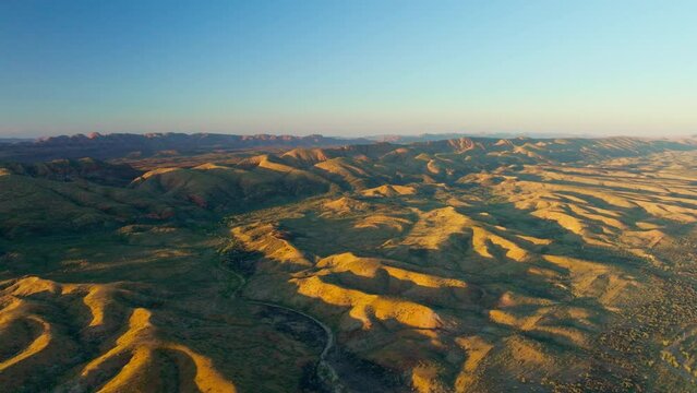 Simpson Desert Aerial Drone On Clear Day With Blue Sky And Sunlight Shadow On Mountains, 4K Australia