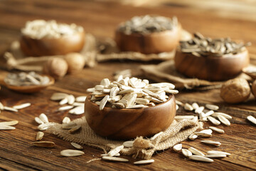 DRİED NUTS AND FRUİTS IN WOODEN BOWL ON BROWN FLOOR