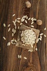 DRİED NUTS AND FRUİTS IN WOODEN BOWL ON BROWN FLOOR