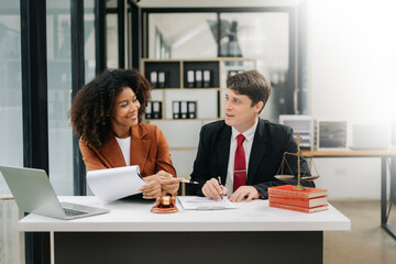 business people and lawyers discussing contract papers sitting at the table. Concepts of law, advice, legal services. in morning light.
