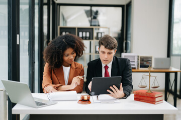 business people and lawyers discussing contract papers sitting at the table. Concepts of law, advice, legal services. in morning light.
