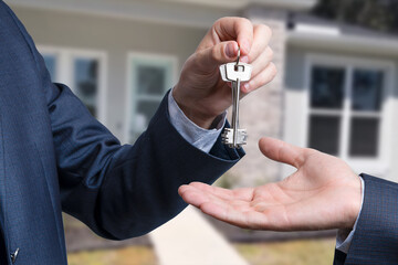 Landlord unlocks the house key for new home.
