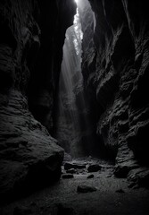 A cave illuminated by a beam of light in a captivating black and white composition