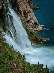 waterfall and  fisherman 