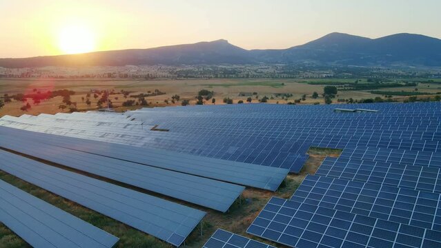 Solar Panels Farm Green Energy, Aerial shot at sunset