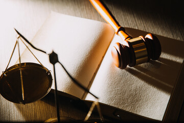 Business and lawyers discussing contract papers with brass scale on desk in office. Law, legal services, advice, justice and law concept picture with film grain effect