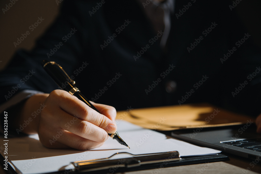 Wall mural business and lawyers discussing contract papers with brass scale on desk in office. law, legal servi