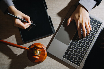 Business and lawyers discussing contract papers with brass scale on desk in office. Law, legal...