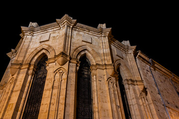 Low angle view of the apse of a gothic church in Zamora, Spain, illuminated at night