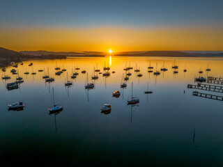 Winter sunrise with clear skies and boats on the water