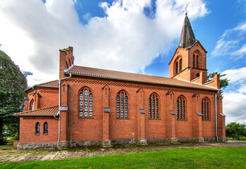 General view and close-up architectural details of the Catholic Church of St. Holy Trinity in the town of Dwawrzuty in Masuria in Poland.