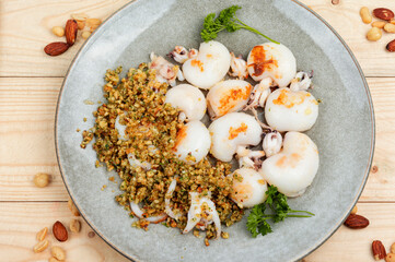 Grilled squids with nuts.