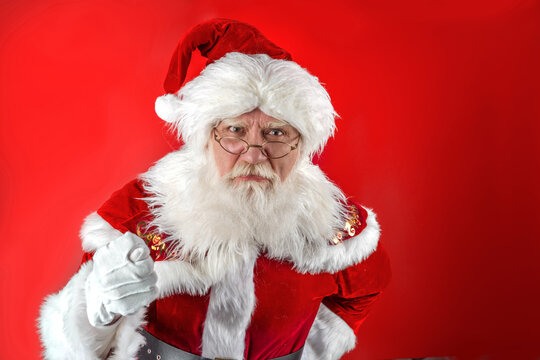 Emotional senior male model old man with a natural white beard Father Christmas
