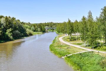 Countryside landscape with river in early summer