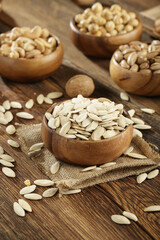 DRİED NUTS AND FRUİTS IN WOODEN BOWL ON BROWN FLOOR