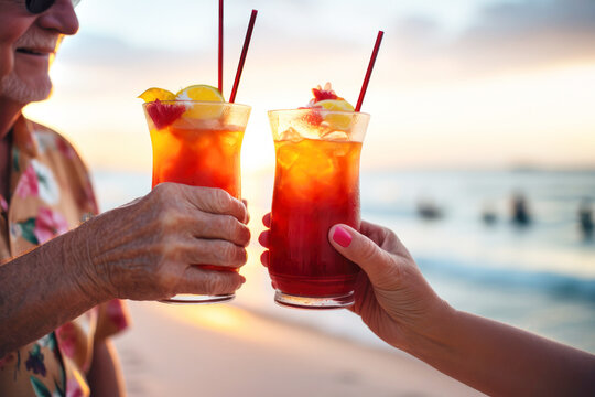 Elderly couple enjoys beachside cocktails