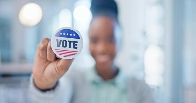 Hand, vote and badge with a black woman in government for support or motivation of a political campaign. Portrait, smile and democracy with a happy voter holding her pin of choice in a party election