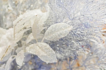 silvery Christmas background of decorative tree branches and leaves.Christmas evening