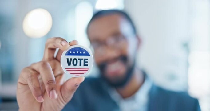 Hand, vote and badge with a black man in government for support or motivation of a political campaign. Portrait, smile and democracy with a happy voter holding his pin of choice in a party election
