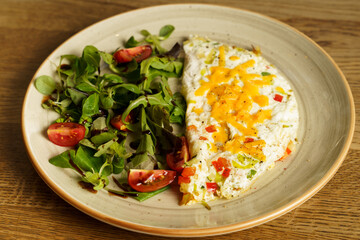 Egg white omelet with cheddar cheese, zucchini, red pepper and leek