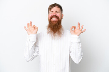 Redhead man with long beard isolated on white background in zen pose