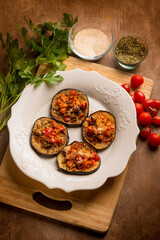 oven grated eggplants with fresh tomatoes and cheese