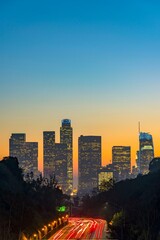 Obraz premium Dawning Urban Energy: 4K Image of Los Angeles Downtown and Morning Traffic at Sunrise