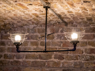 Old ancient lamps on the wall in a dark room background, gloomy light